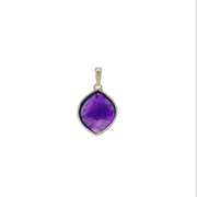 Purple gemstone amethyst pendant with silver frame on a white background